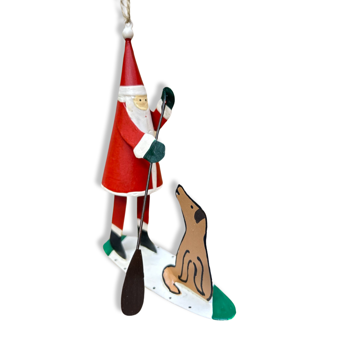 Paddle boarding Santa with dog friend hanging Christmas ornament
