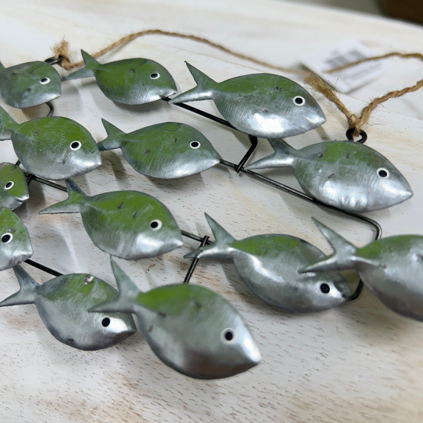 Hanging school of fish in silver