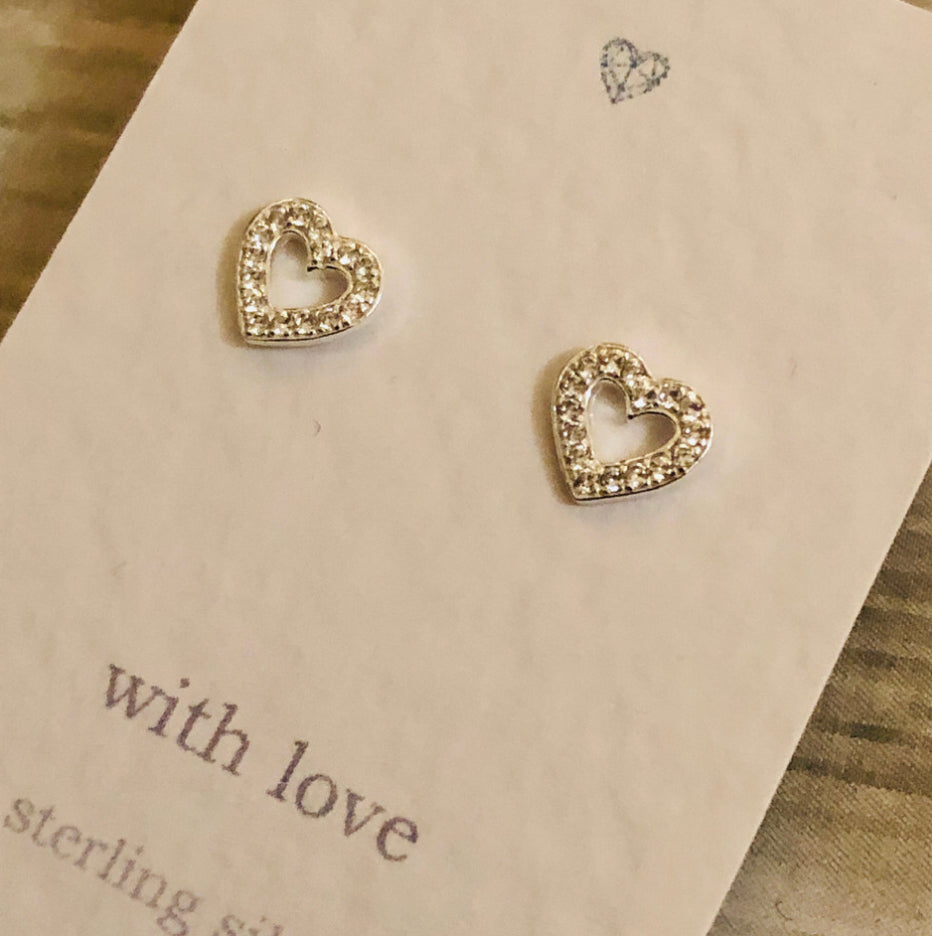Heart outline cubic zirconia sterling silver stud earrings.