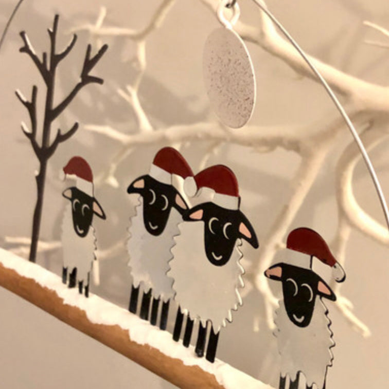 Winter woolly four sheep wearing Christmas hats . Hanging ornament by Sjoeless Joe