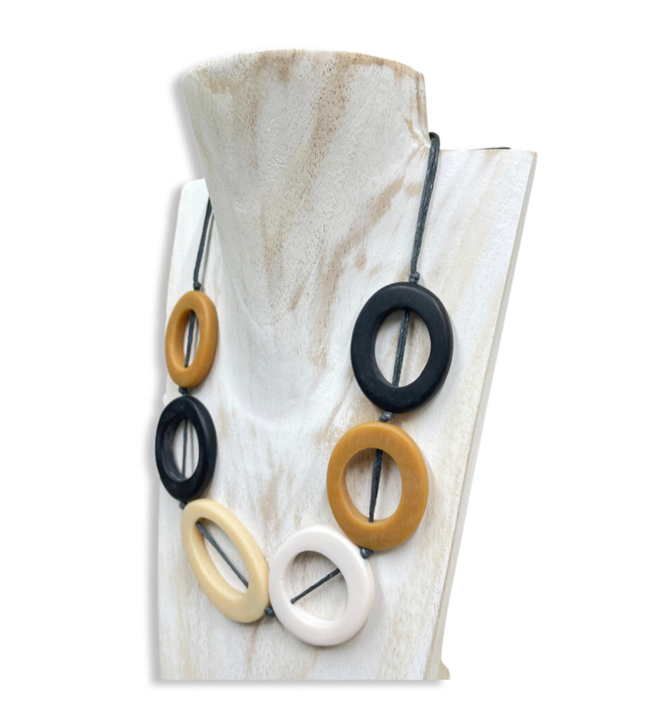 Short resin hoop necklace in tan, black & cream by Suzie Blue.