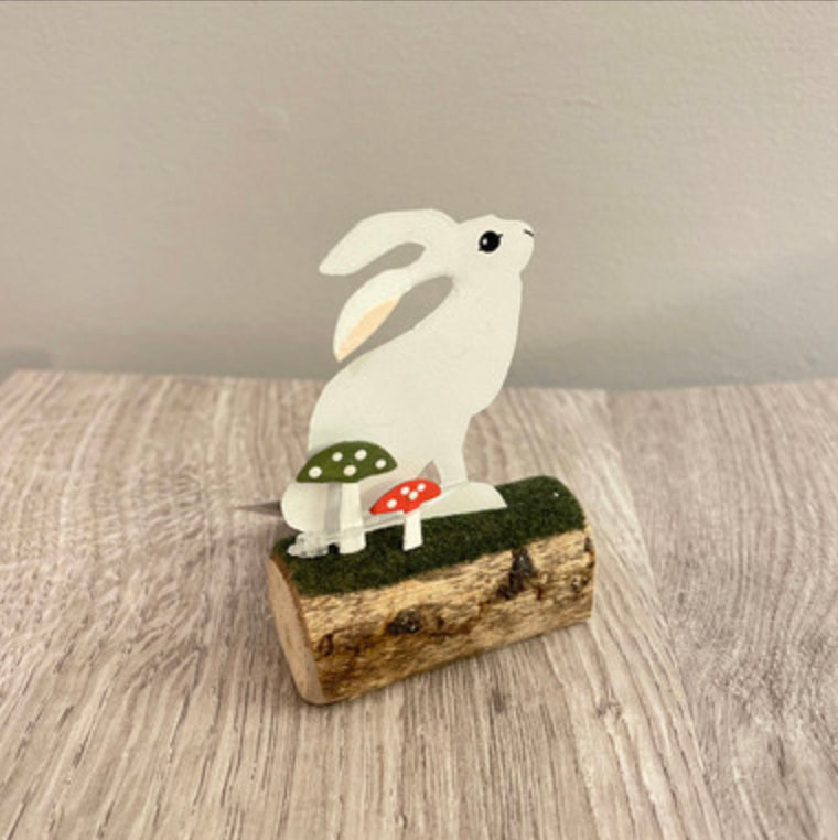 Artic hare standing or sitting on log. Ornament by Shoeless Joe