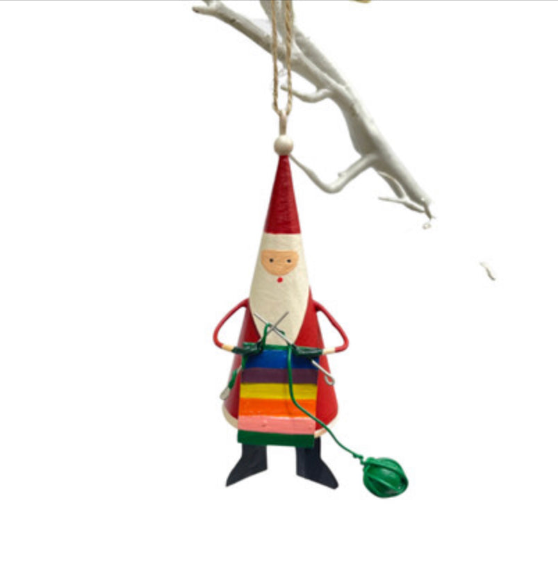 Santa knitting a rainbow. Father Christmas tree decoration by Shoeless Joe