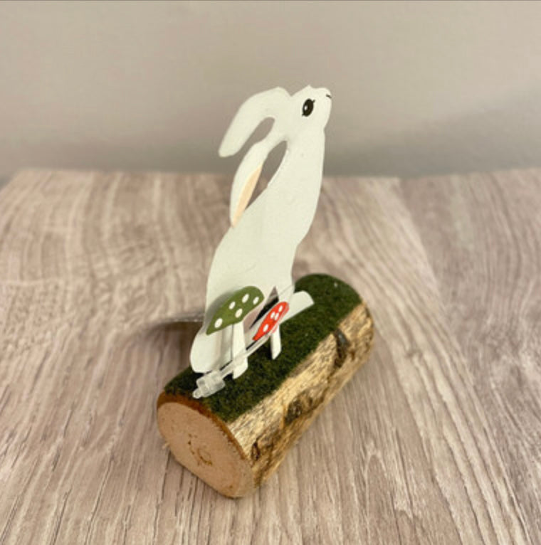 Artic hare standing or sitting on log. Ornament by Shoeless Joe