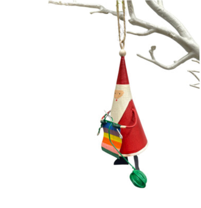 Santa knitting a rainbow. Father Christmas tree decoration by Shoeless Joe