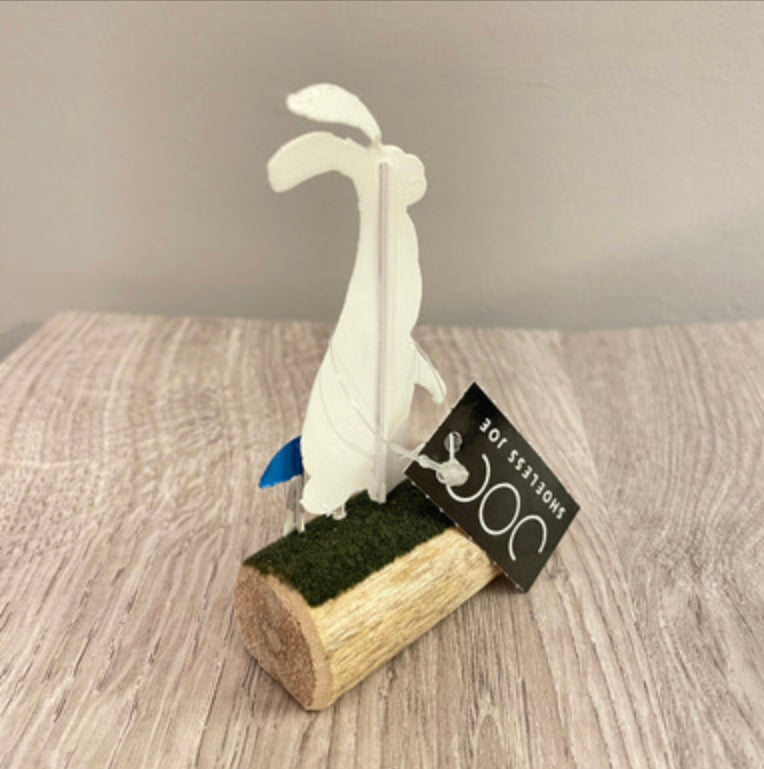 Artic hare standing or sitting on log. Ornament by Shoeless Joe