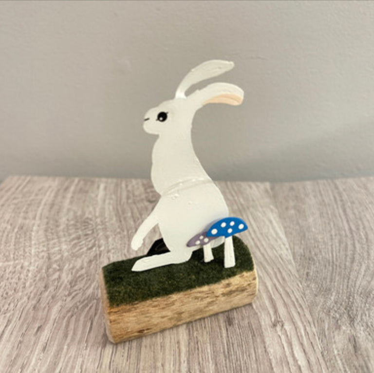 Artic hare standing or sitting on log. Ornament by Shoeless Joe