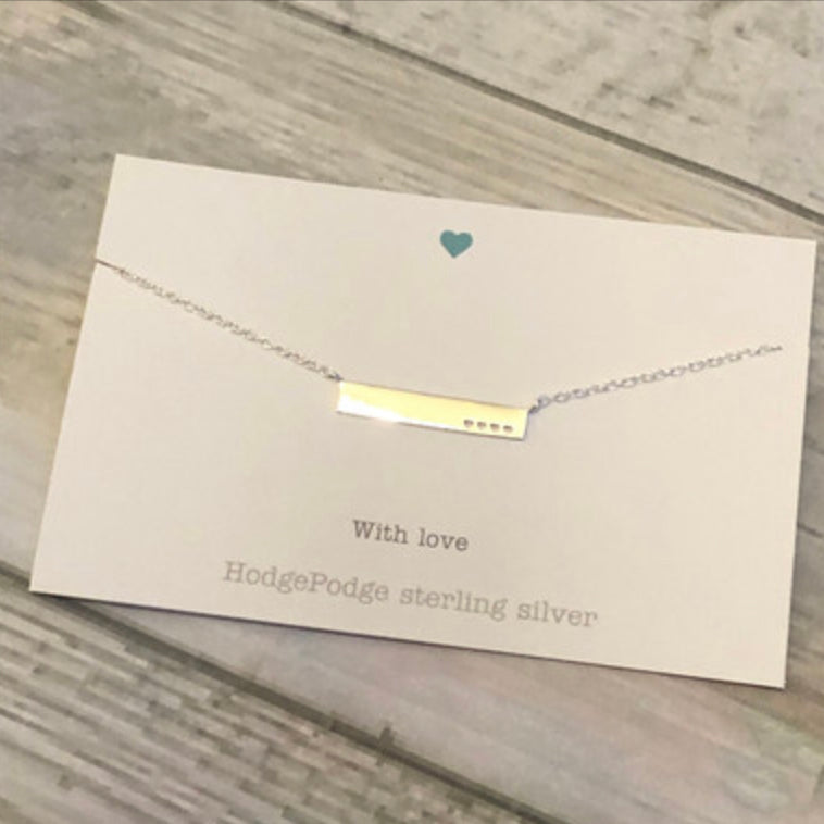 Sterling silver bar with heart cut-outs necklace
