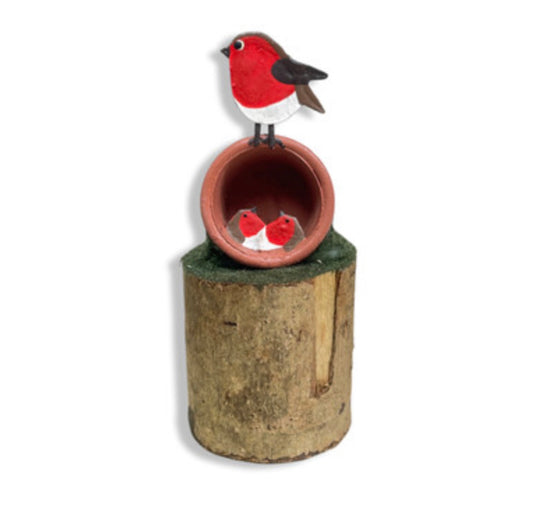 Robins nesting in a plant pot standing ornament by Shoeless Joe