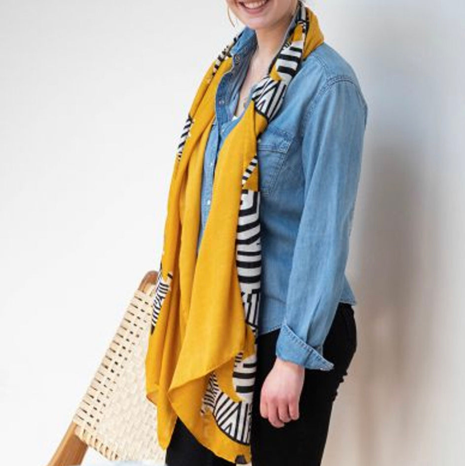 Graphic zebra print scarf with a mustard border by POM