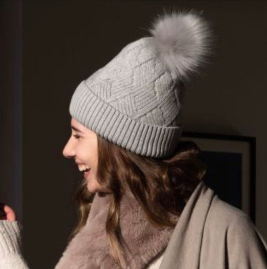 Grey diamond knit hat with faux fur bobble By Pom