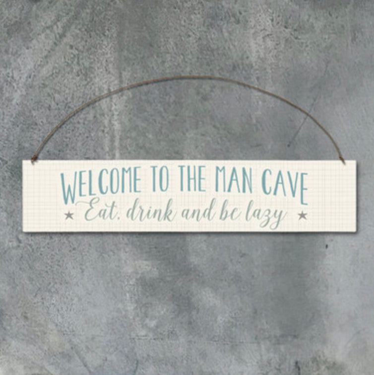 Welcome to the man cave. Eat, drink and be lazy. Hanging sign by East of India