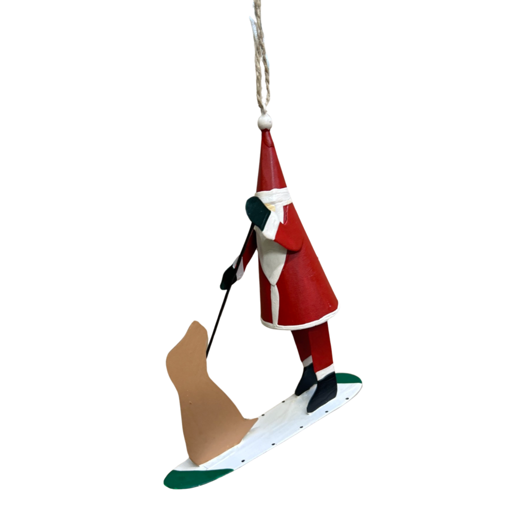 Paddle boarding Santa with dog friend hanging Christmas ornament