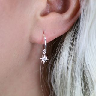 Sterling silver sleeper earrings with rhinestone inset stars