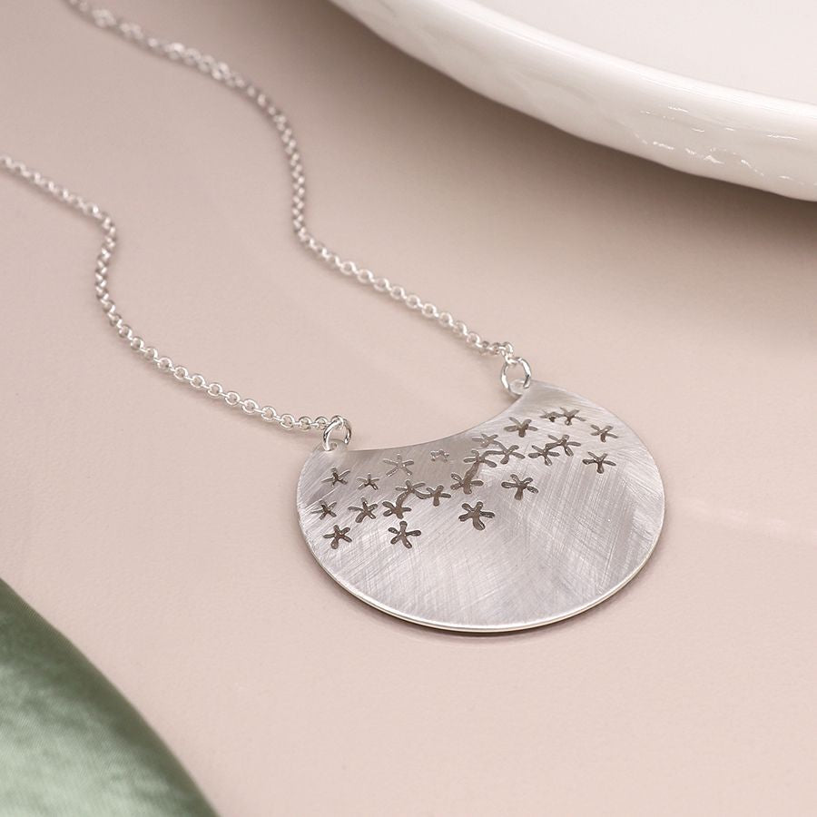 Silver plated scratched disc star cut-out necklace