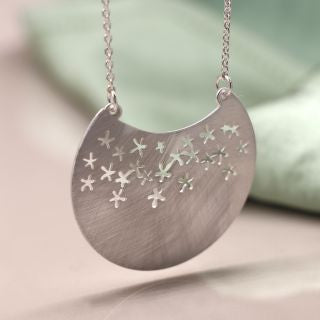 Silver plated scratched disc star cut-out necklace